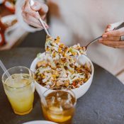 Woman eating a healthy salad to support digestion and gut health